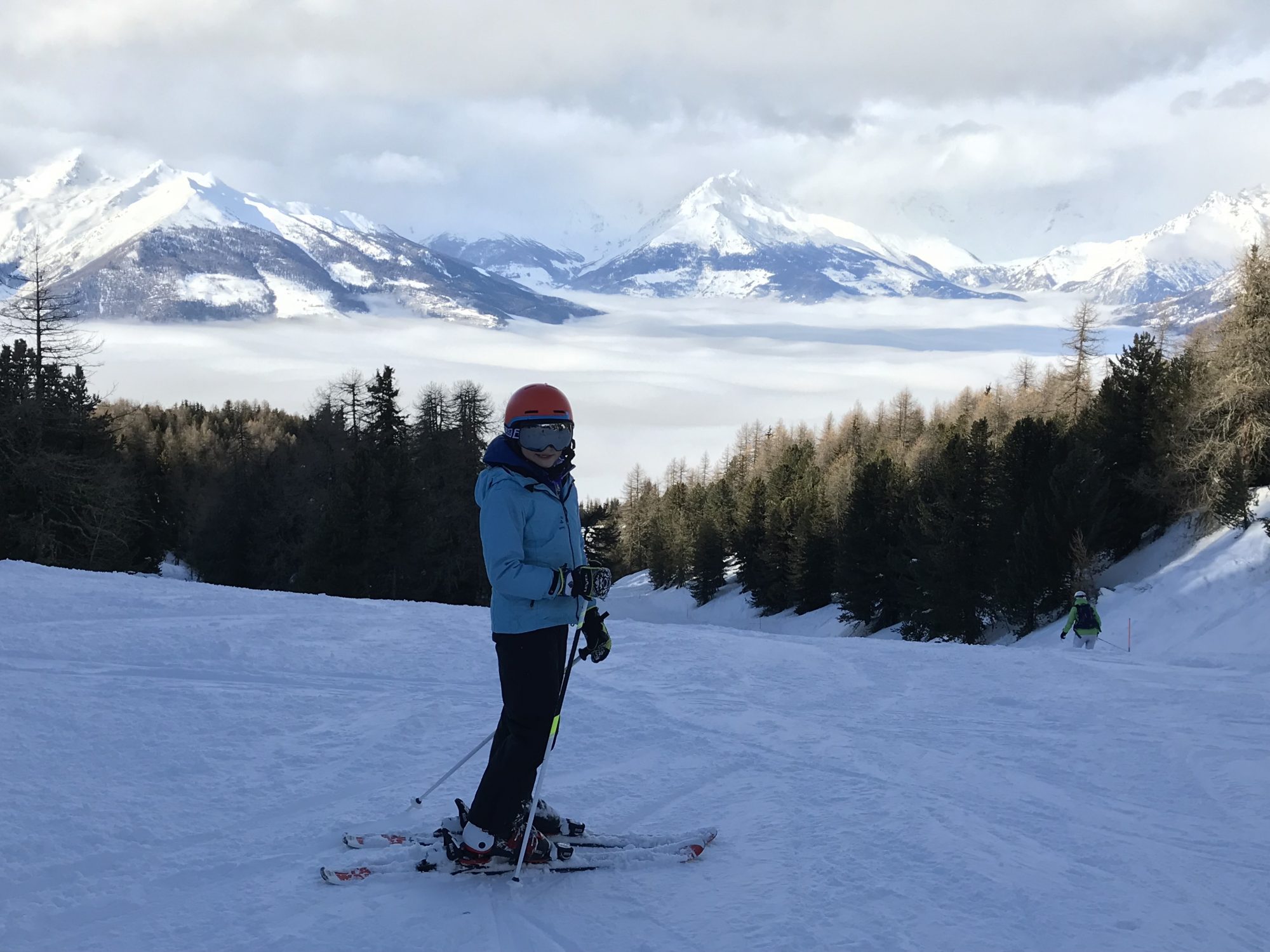 My eldest ready to go down red 2, with the cloud down the mountain. Photo by The-Ski-Guru.