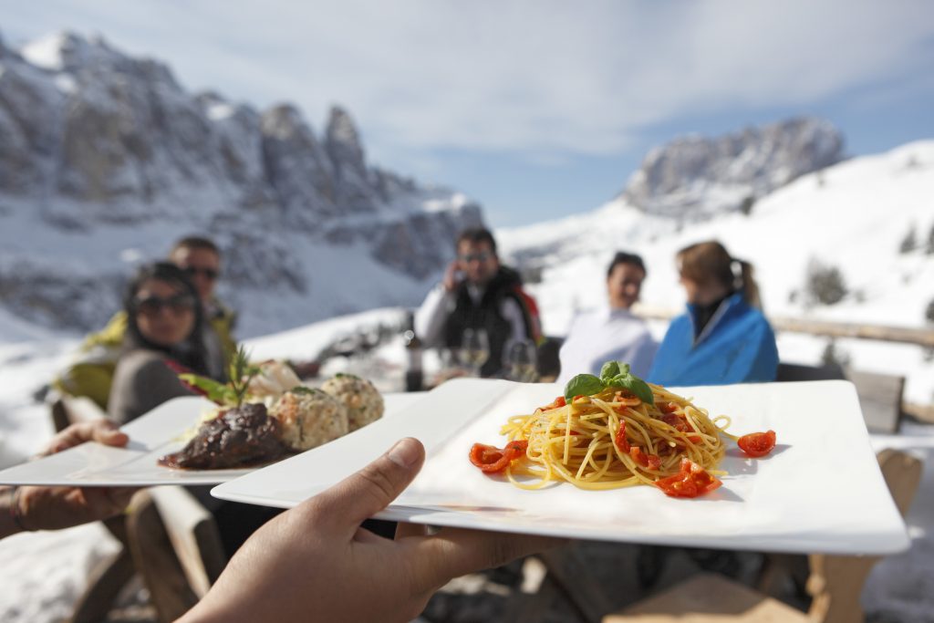 The Alpine huts along the ski slopes of the Gardena Valley serve local fare mixing traditional Italian with South Tyrolean dishes; against the magnificent background of the snow-capped peaks of the Sella Mountain Group in the Dolomites. Photo: IDM Sudtirol - The roof of the Rifugio Comici in Selva Val Gardena was restored in record time. Photo: IDM Sudtirol - The roof of the Rifugio Comici in Selva Val Gardena was restored in record time.