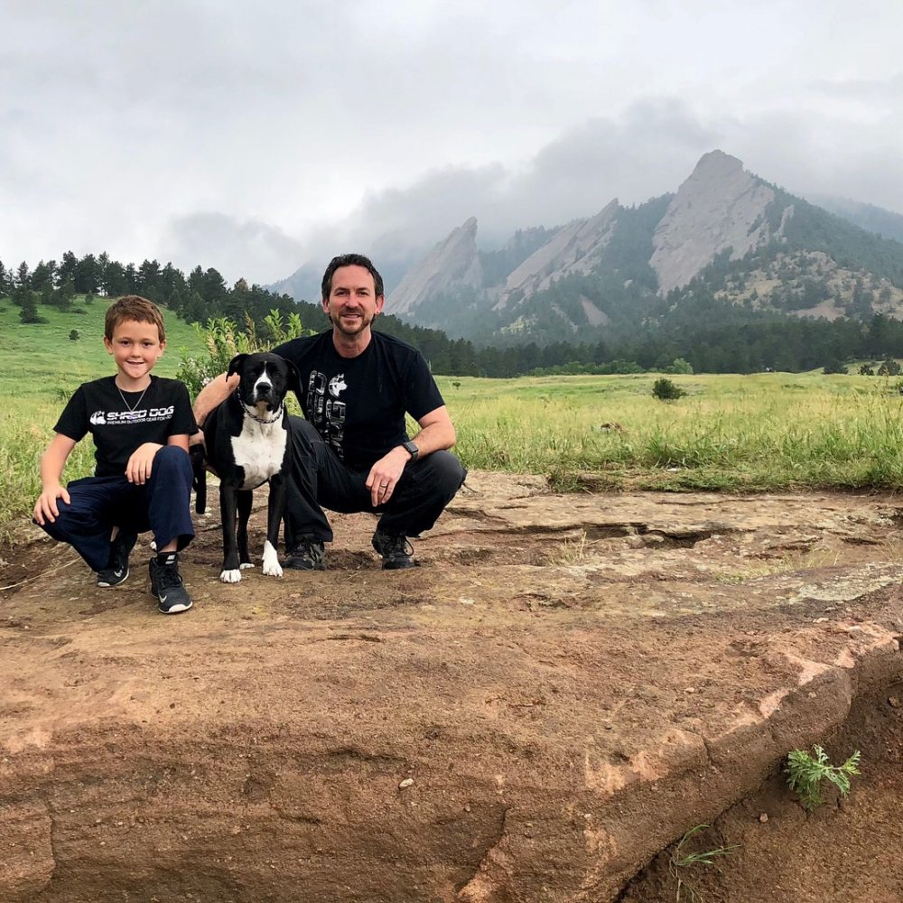 Marc Dietz with his son Ryker with the Flatirons near Boulder. Courtesy of Shred-Dog. Shred-Dog stands for High Performance Kids’ Snow Gear with Incredible Value.