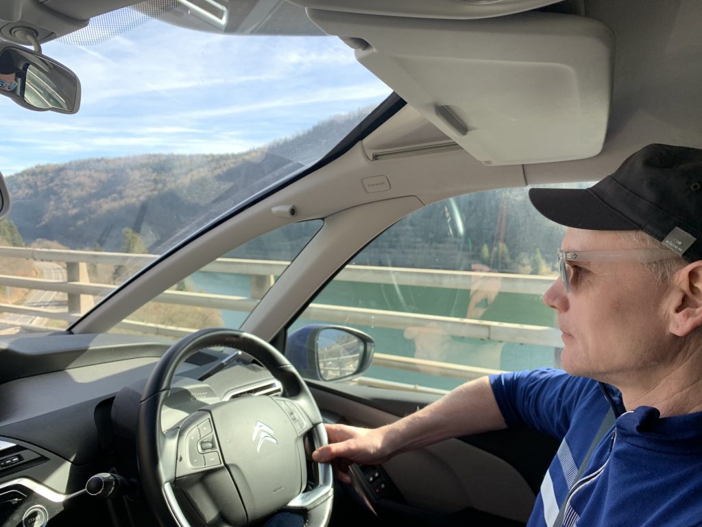 My husband driving over a viaduct near Nantua. Driving back for the first time from Morgex to London