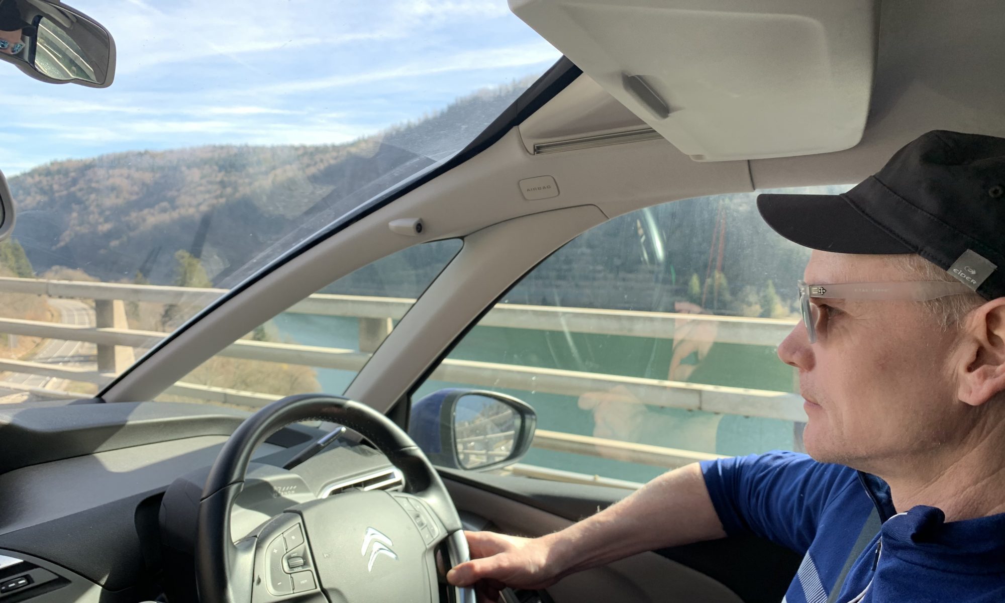 My husband driving over a viaduct near Nantua. Driving back for the first time from Morgex to London