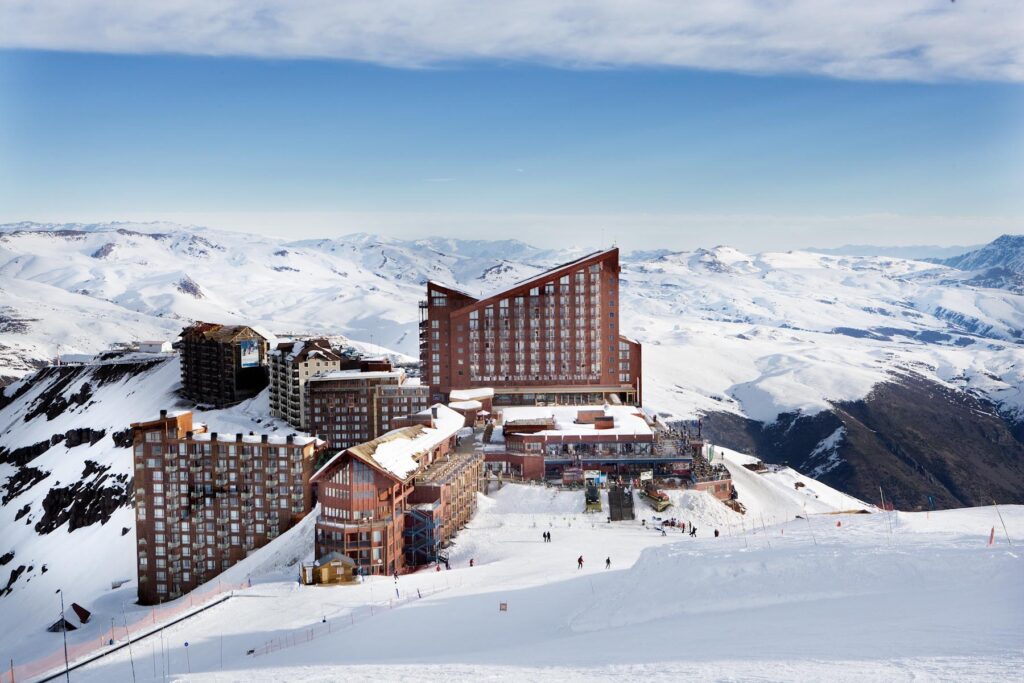 The Hotel Valle Nevado in the front, with the towering Puerta del Sol in the background. Photo courtesy Valle Nevado. 