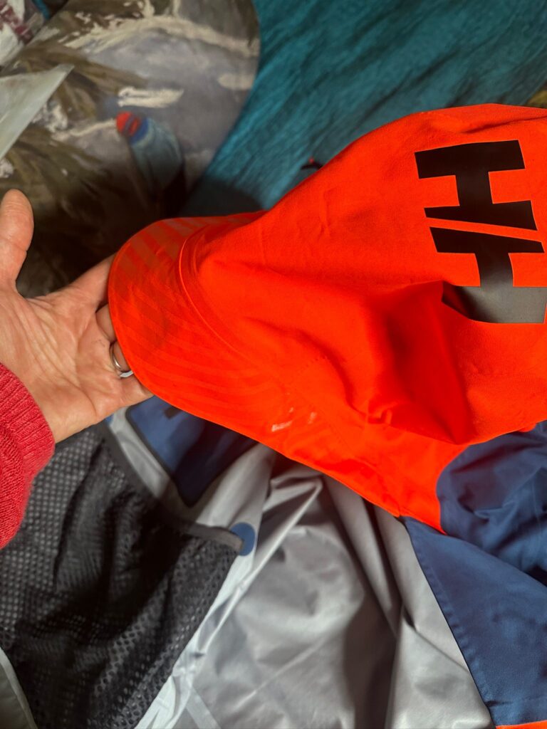 The hood is very big, designed to cover a helmet. I love the bright colours- they can surely see you in a bad weather day with this jacket! Photo: The-Ski-Guru