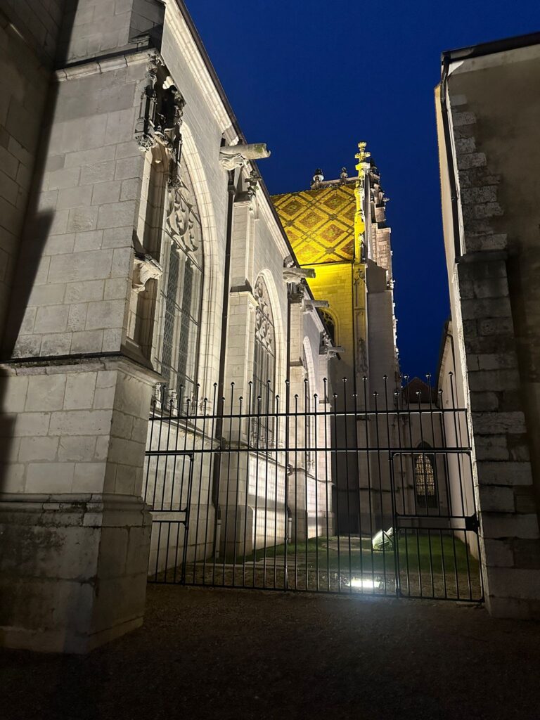 The Royal Monastery de Brou in Bourg-en-Bresse at night, just one block from our hotel Cit'Hotel Le Logis de Brou. Photo: The-Ski-Guru